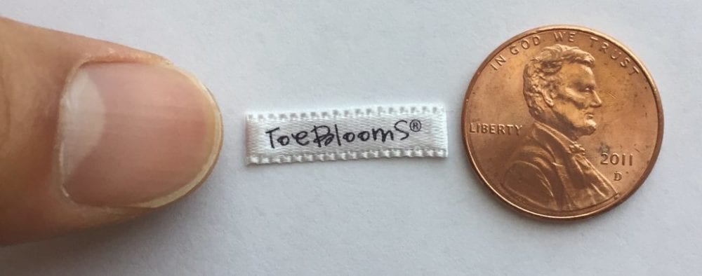 Small finished edge satin label - end folded