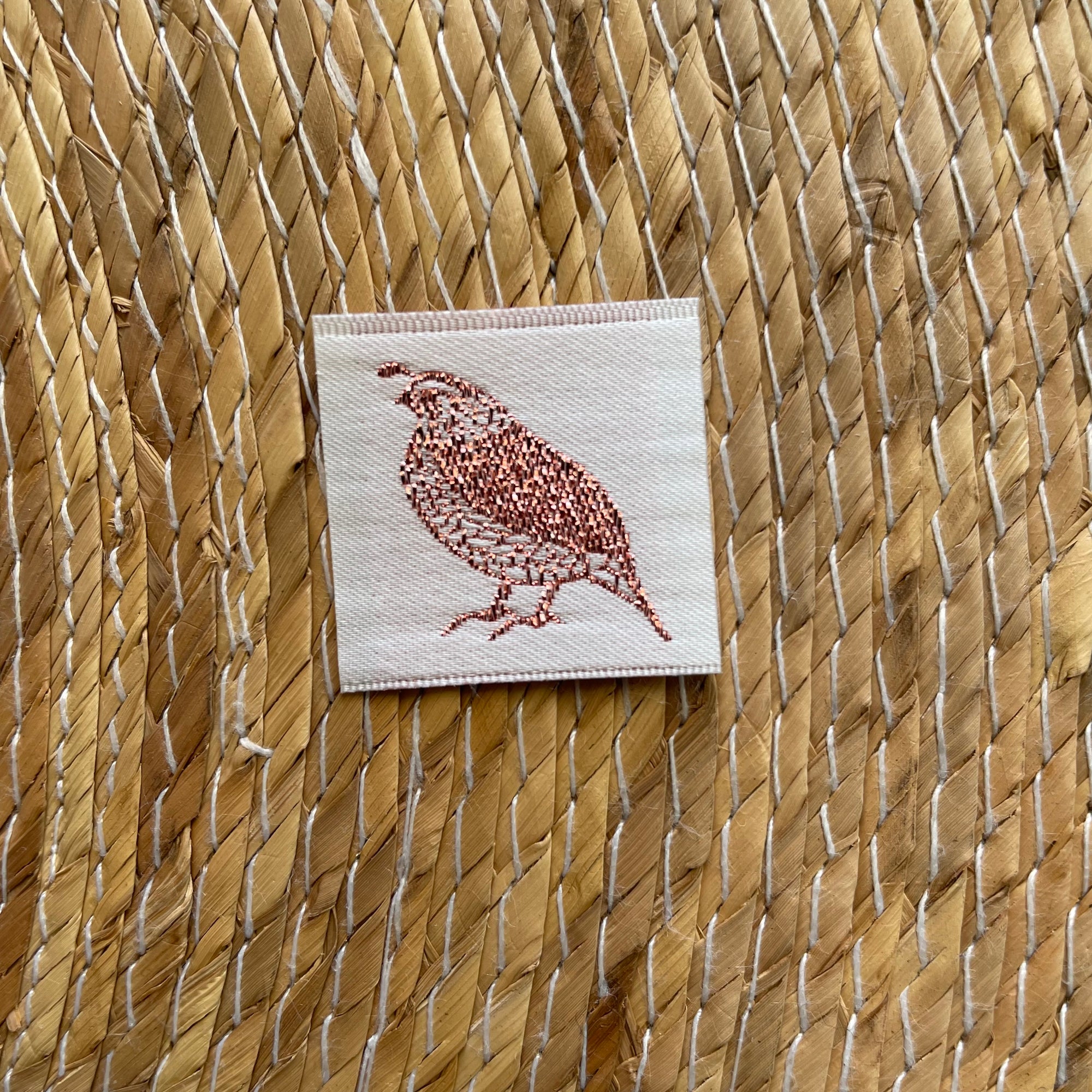 Satin woven label with lurex thread